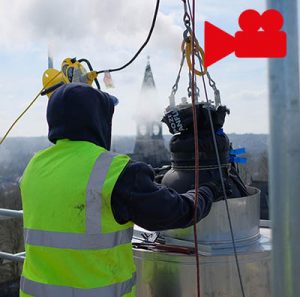 worker inspecting chimney liner